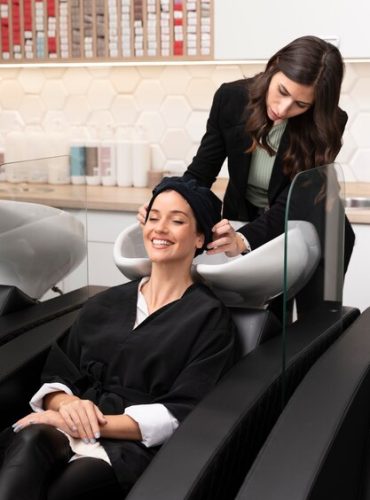 woman-getting-treatment-hairdresser-shop_23-2149230929